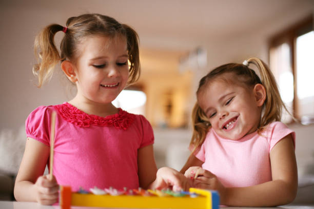 istock Two little girl at music school. 638677722