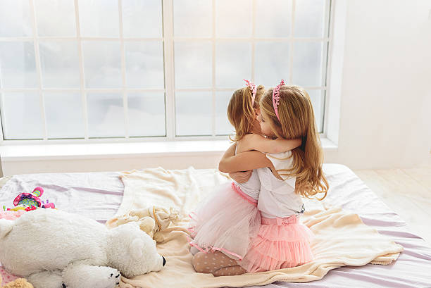 istock Cute girls hugging with friendship 638677726