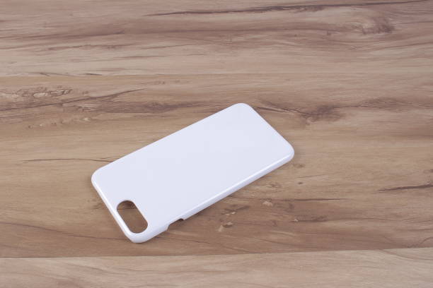 istock Case for smart phone on wood background 638677890