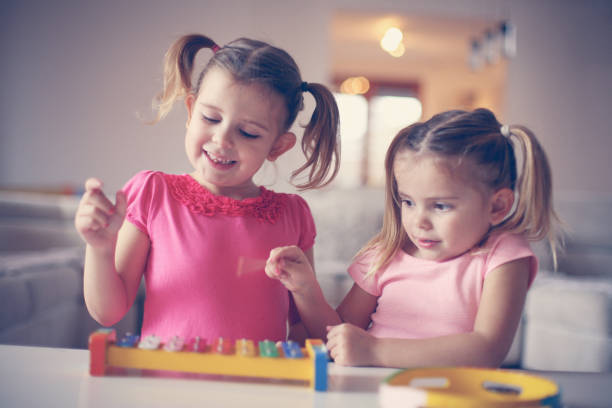 istock Two little girl at music school. 638677918