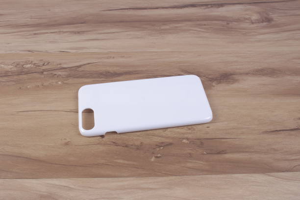 istock Case for smart phone on wood background 638677958