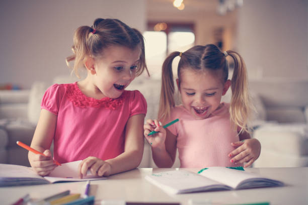 istock Cute little girls drawing. 638678220