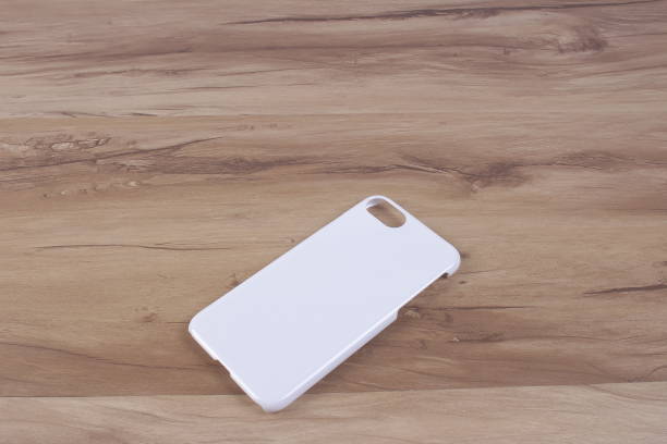 istock Case for smart phone on wood background 638678368