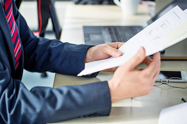 istock Businessman hands with financial reports 638678428
