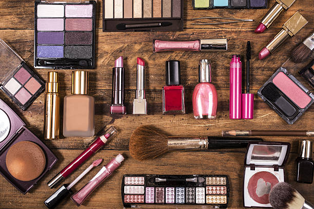 istock Various cosmetics, make-up lie on wooden dressing table. 638678584
