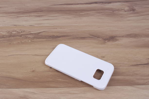 istock Case for smart phone on wood background 638679868