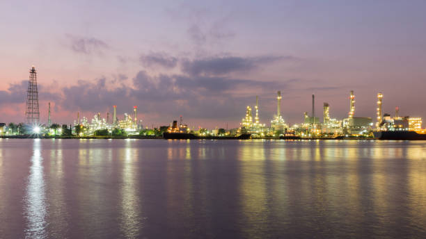 istock Panorama Oil refinery river front after sunset 638680028
