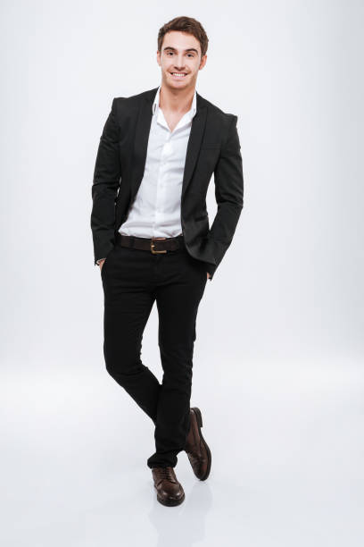istock Full length smiling bearded business man in black suit 638680158