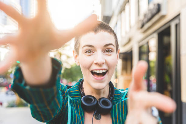 istock Young woman catching the camera with hands 638680166