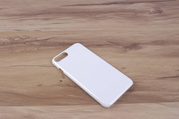 istock Case for smart phone on wood background 638680256