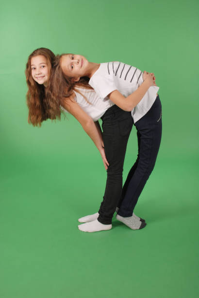 istock Two friends school girls back to back 638680612