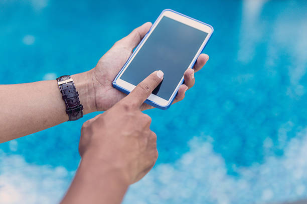 istock Young male index finger touching smartphone screen 638680976