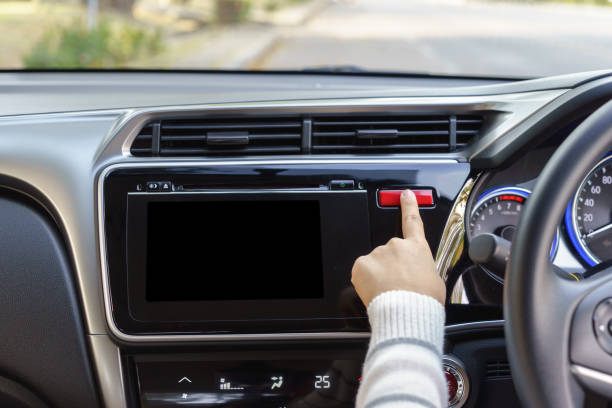 istock woman finger pressing emergency button on car dashboard 638681140