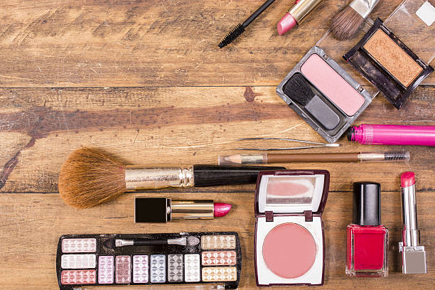 istock Various cosmetics, make-up lie on wooden dressing table. 638681370