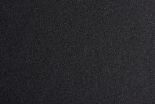 Black cardboard texture with blank space for text. This file is cleaned and retouched.