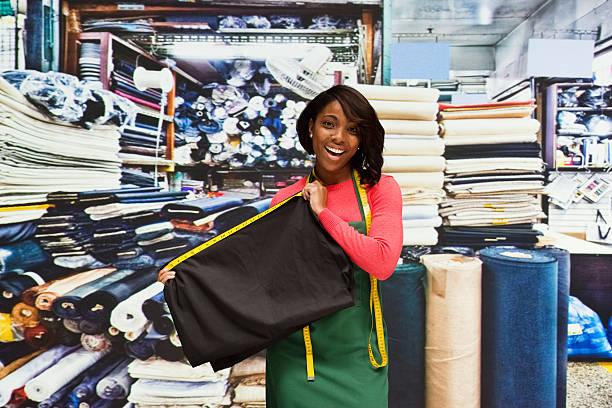 smiling seamstress in textile industry - silk stockings imagens e fotografias de stock