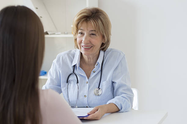 istock Female doctor with patient 638687510