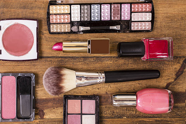 istock Various cosmetics, make-up lie on wooden dressing table. 638687640