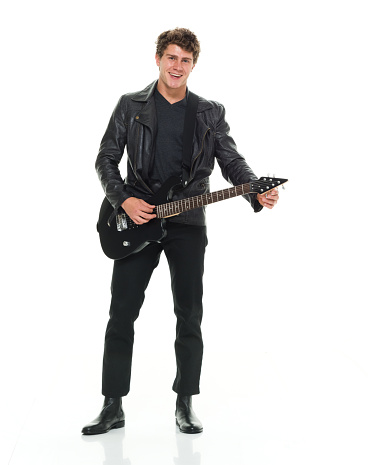 Smiling man playing guitar