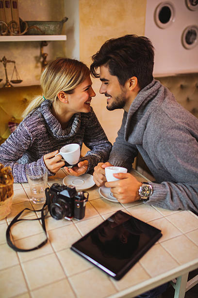 istock Two young photographers flirting during coffee break in cafe. 638693058