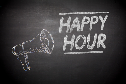 Happy hour sign on chalkboard with megaphone