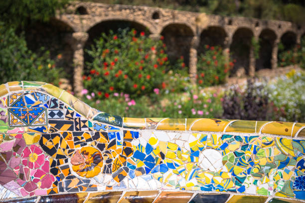 Pavilion decorated with mosaic in Park Guell starting the sunset, Barcelona