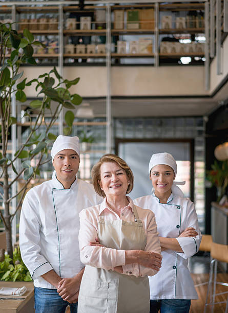 istock Business owner with chefs at a restaurant 638695380
