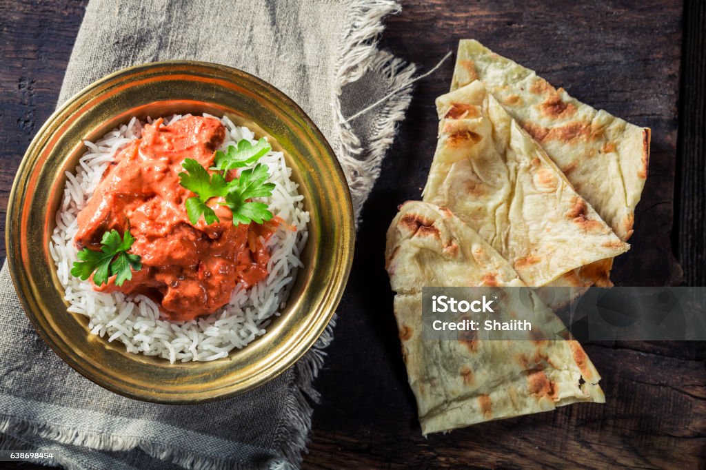 Tikka masala with rice and chicken served with Naan bread Asia Stock Photo