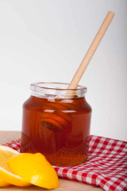 istock Honey in jar on a wooden background 638700878