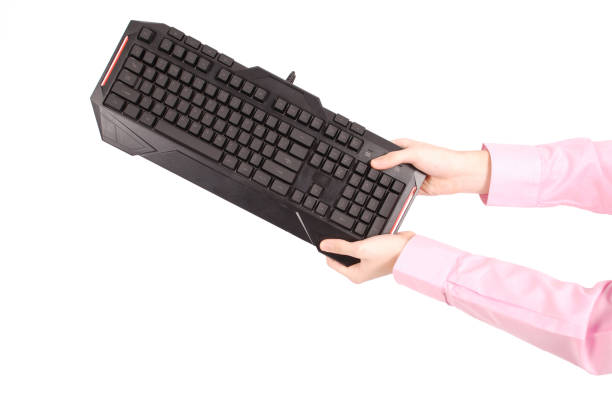 istock Teenage boy with computer keyboard 638701744