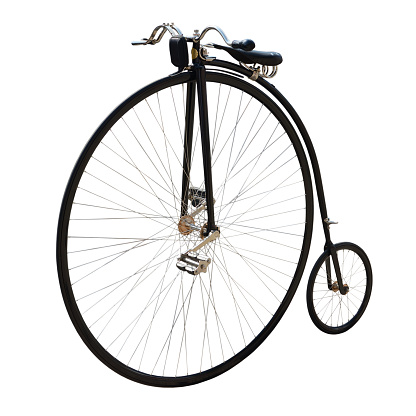 Penny-farthing or high wheel or ordinary. Bicycle with a large front wheel isolated on white.