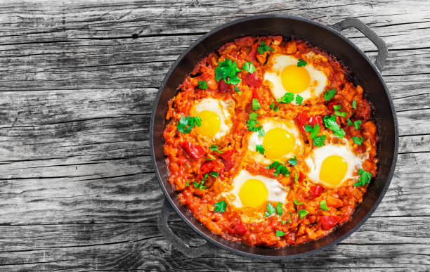 istock delicious shakshuka - fried eggs, onion,bell peppers,tomatoes an 638702936