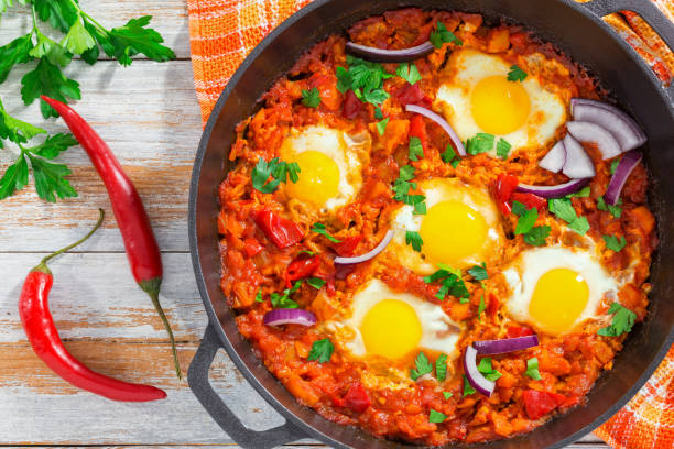 istock healthy breakfast shakshuka - fried eggs, tomato, pepper and spi 638703152