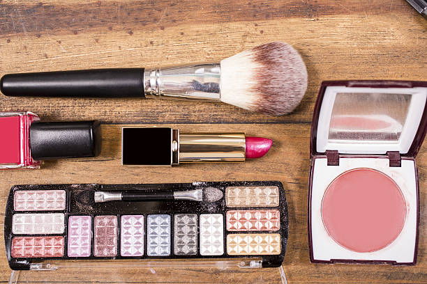 istock Various cosmetics, make-up lie on wooden dressing table. 638703290