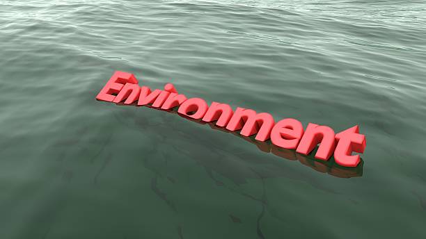 istock Red word environment swimming in the ocean sinking 638704472