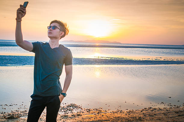 istock Man enjoy with sunset and tropical beach background 638705564