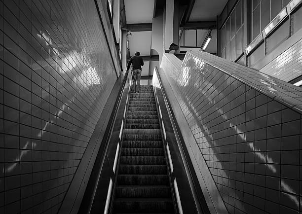 istock Low Angle View Of Man On Escalator At Railroad Station 638707223