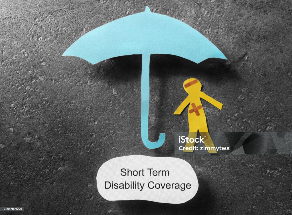 Short Term Disability concept bandaged paper man under umbrella with Short Term Disability Coverage note below Disability Stock Photo