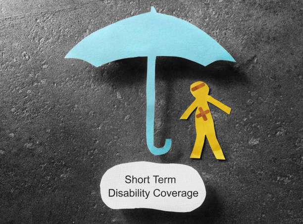 Short Term Disability concept bandaged paper man under umbrella with Short Term Disability Coverage note below short length stock pictures, royalty-free photos & images