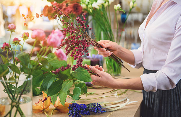 istock Professional florist making beautiful bouquet 638709572