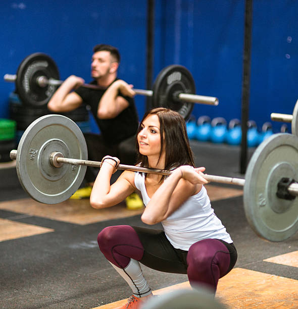 istock strong woman weightlifting a barbell 638710106
