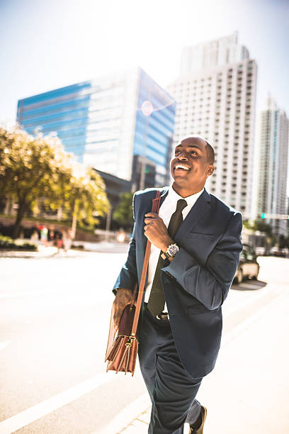 afro american businessman running in miami downtown afro american businessman running in miami downtown car portrait men expertise stock pictures, royalty-free photos & images