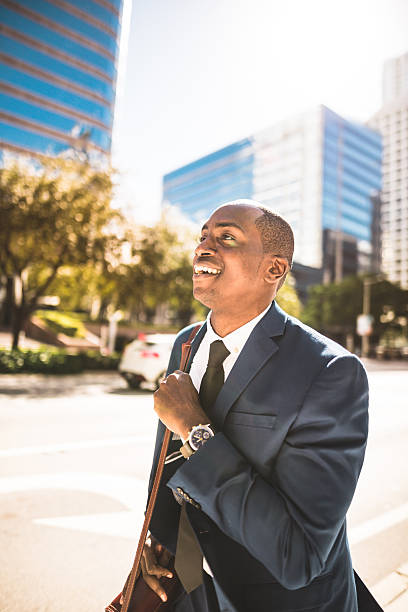 istock afro american businessman running in miami downtown 638710316