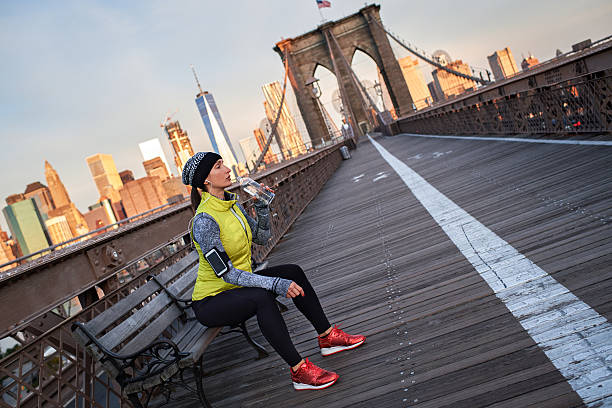 istock Female athlete hydrating on the bridge 638710622