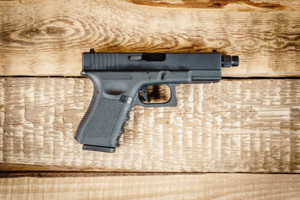 istock top view of a black pistol 638710760