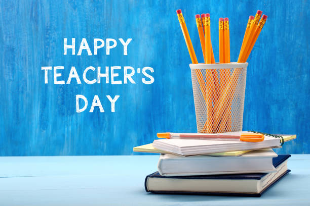 istock School supplies on blackboard background with inscription Teache 638711468