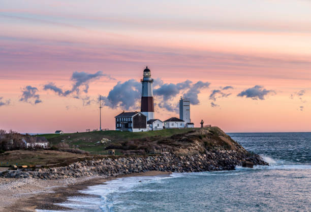 Montauk Point Light, Lighthouse, Long Island, New York, Suffolk Atlantic ocean waves on the beach at Montauk Point Light, Lighthouse, Long Island, New York, Suffolk County montauk point stock pictures, royalty-free photos & images