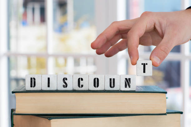 istock DISCOUNT Concept , Hand with alphabet blocks 638712506