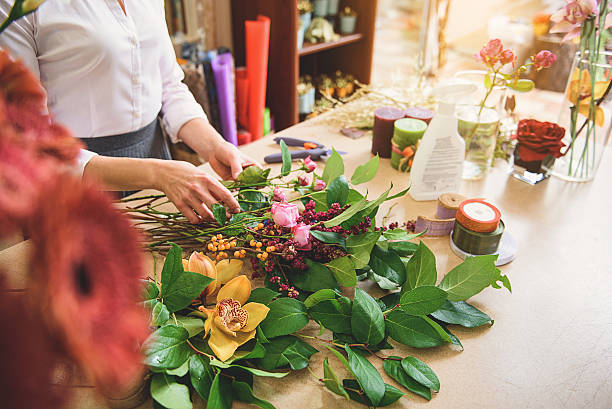 istock Professional florist creating masterpiece from plants 638712550
