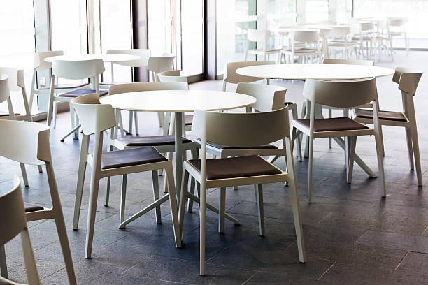 istock Cafe with modern white plastics round tables and chairs 638713148